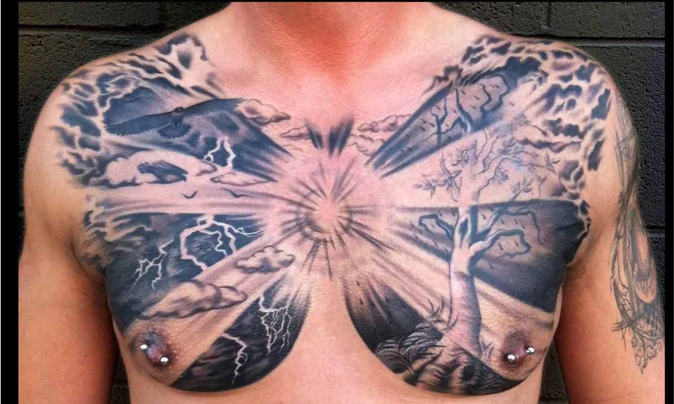 Black Ink Clouds With Tree Tattoo On Man Chest