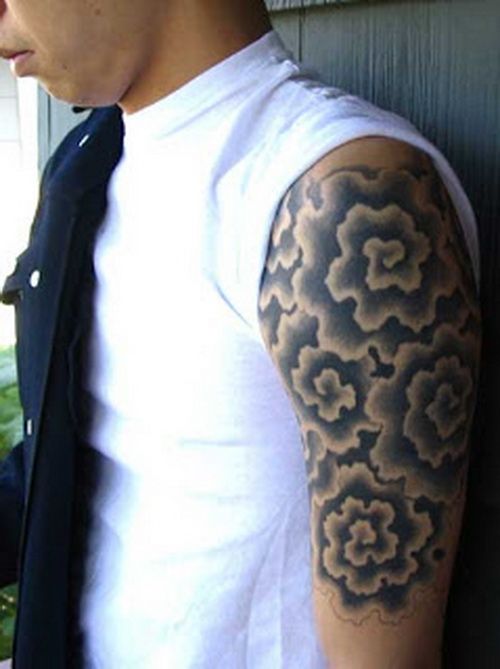 Black Ink Japanese Cloud Shading Tattoo On Man Left Half Sleeve