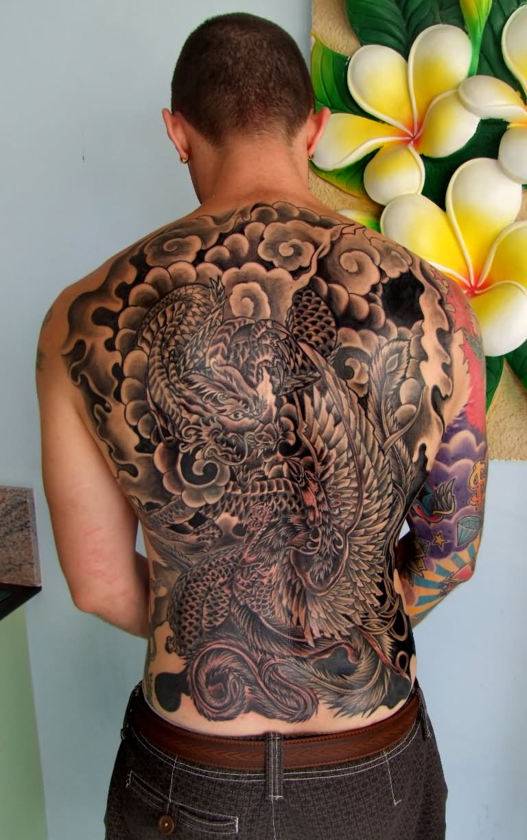 Black Ink Japanese Dragon With Clouds Tattoo On Man Full Back
