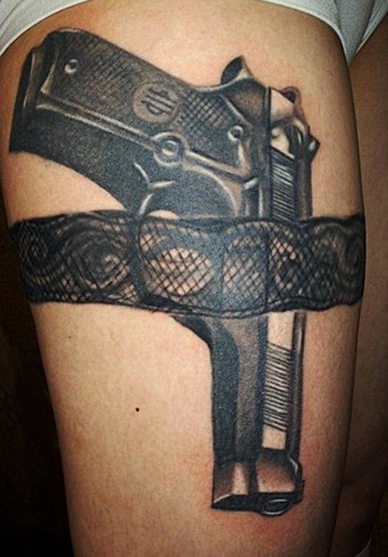 Black Ink Revolver Tattoo On Side Hip