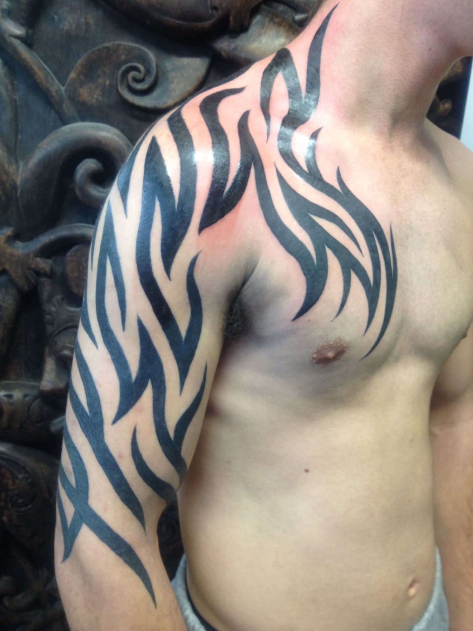 Black Tribal Design Tattoo On Man Right Full Sleeve