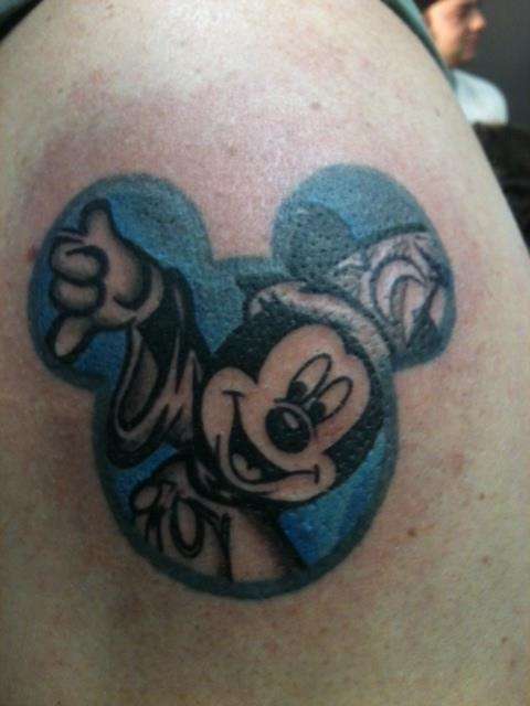 Blue Ink Mickey Mouse Tattoo On Shoulder