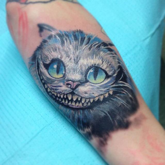 Cheshire Cat Head Tattoo On Arm