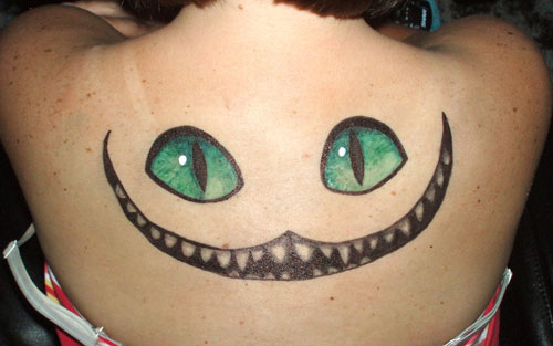 Cheshire Cat Tattoo On Girl Upper Back