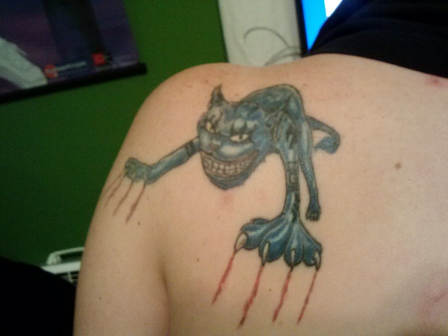 Cheshire Cat Tattoo On Left Back Shoulder by Wond3rfullywick3d