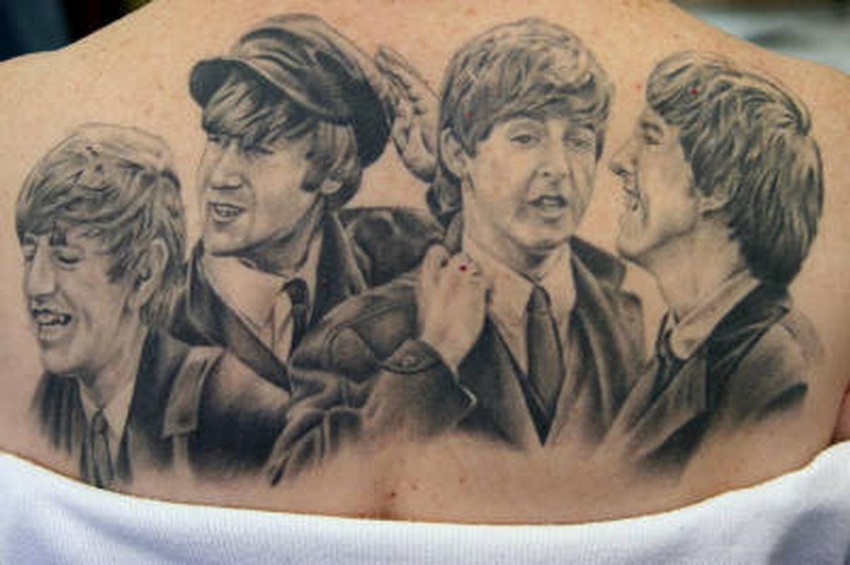 Classic Grey Ink Beatles Tattoo On Upper Back
