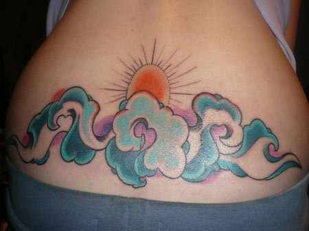 Clouds With Sun Tattoo On Lower Back