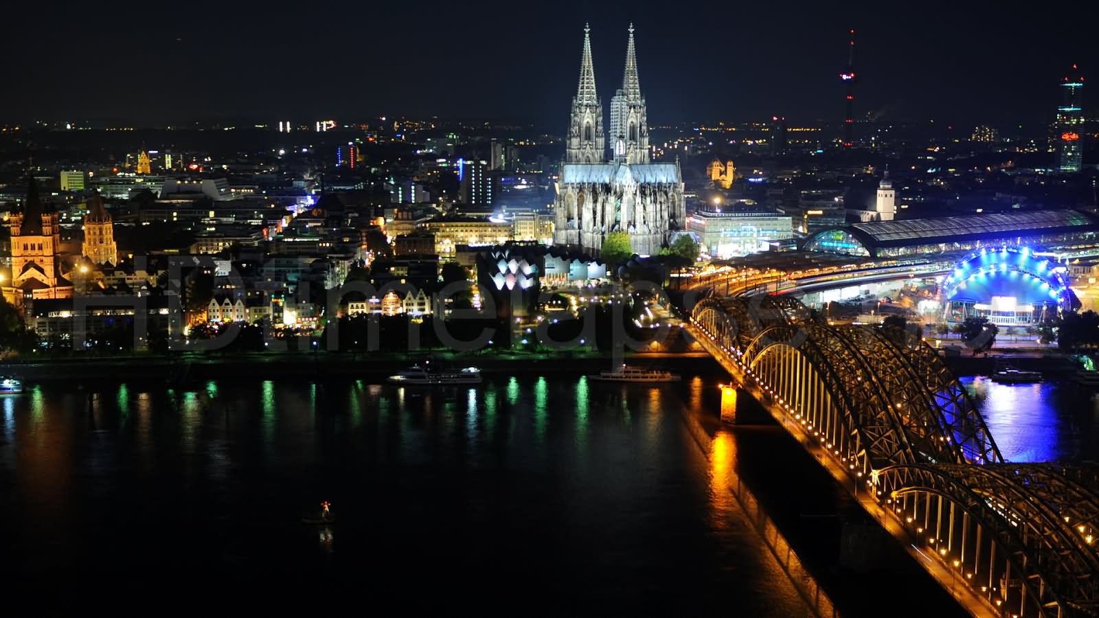 Cologne Cathedral And Hohenzollern Bridge Lit up At Night