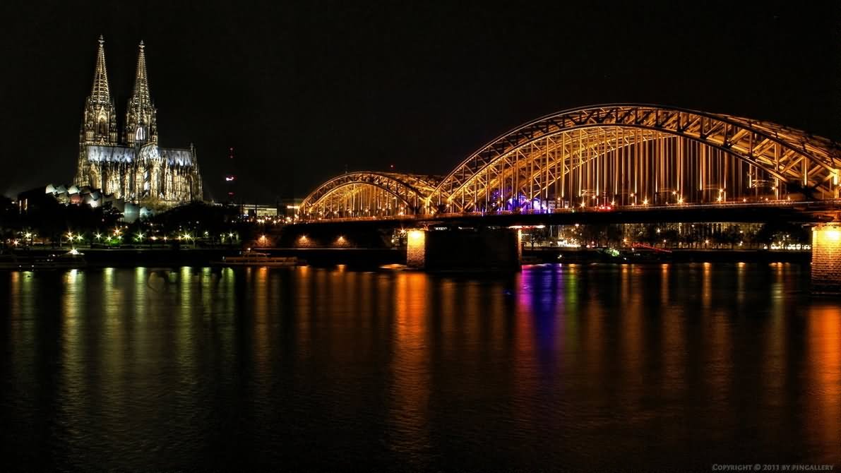 Cologne Cathedral View Across The Rhine River At Night