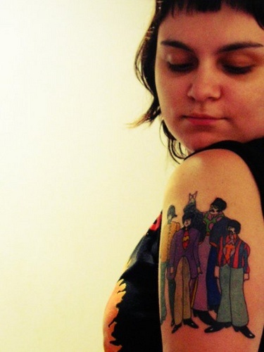 Colorful Beatles Tattoo On Girl Left Half Sleeve