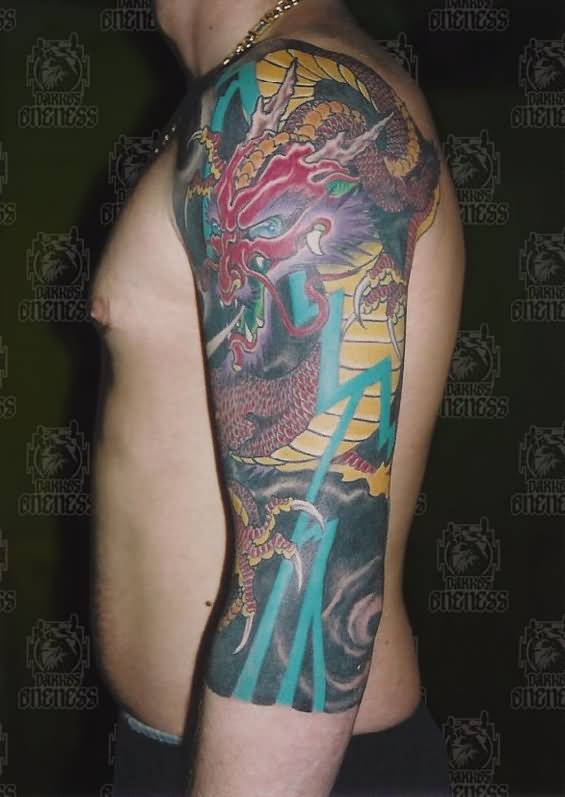 Colorful Japanese Dragon Tattoo On Man Left Half Sleeve