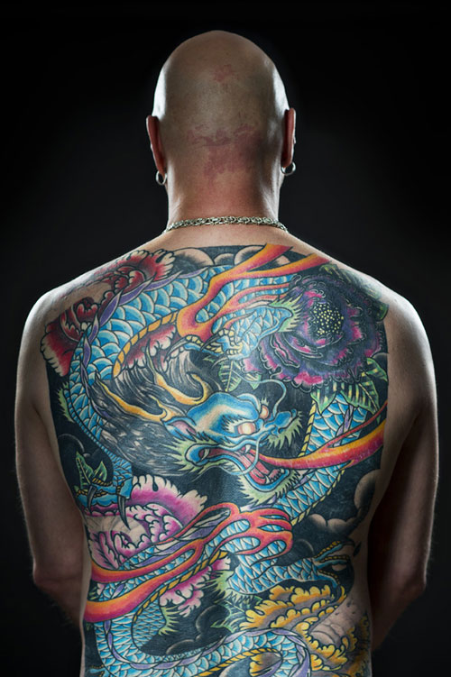 Colorful Japanese Dragon With Flowers Tattoo On Man Full Back