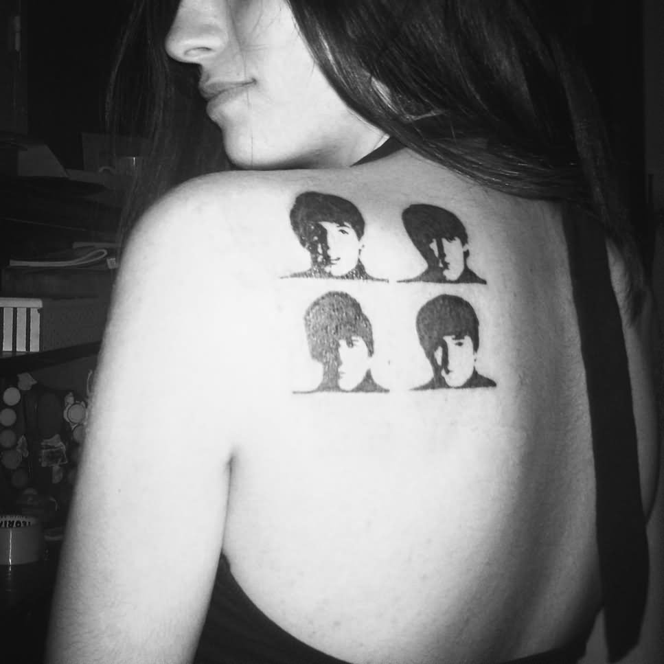 Cool Black Beatles Faces Tattoo On Girl Left Back Shoulder