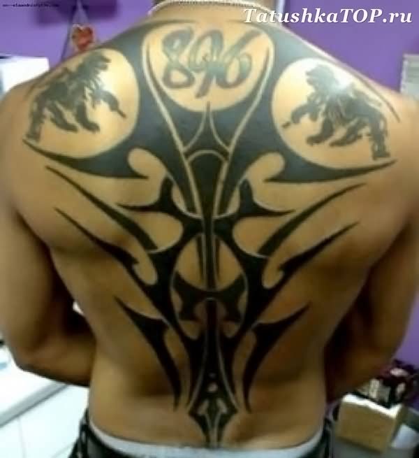 Cool Black Tribal Design Tattoo On Full Back
