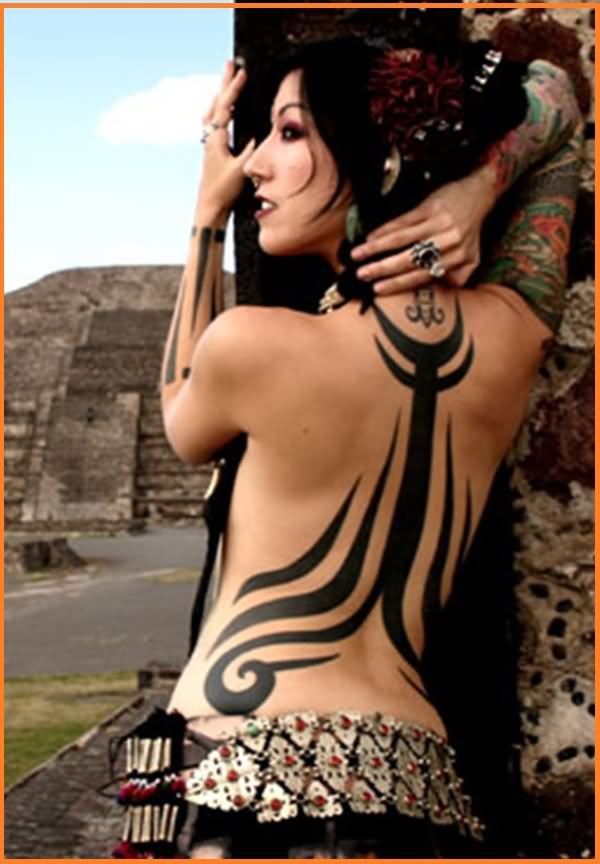 Cool Black Tribal Design Tattoo On Women Full Back