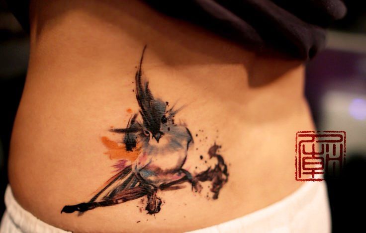 Cute Abstract Bird Tattoo On Lower Back