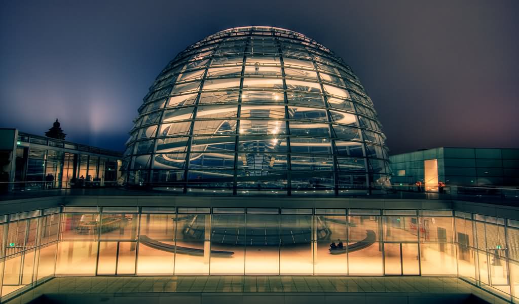 Dome On The Top Of The Reichstag Building Lit Up At Night