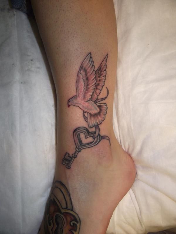 Dove Flying With Key Tattoo On Ankle