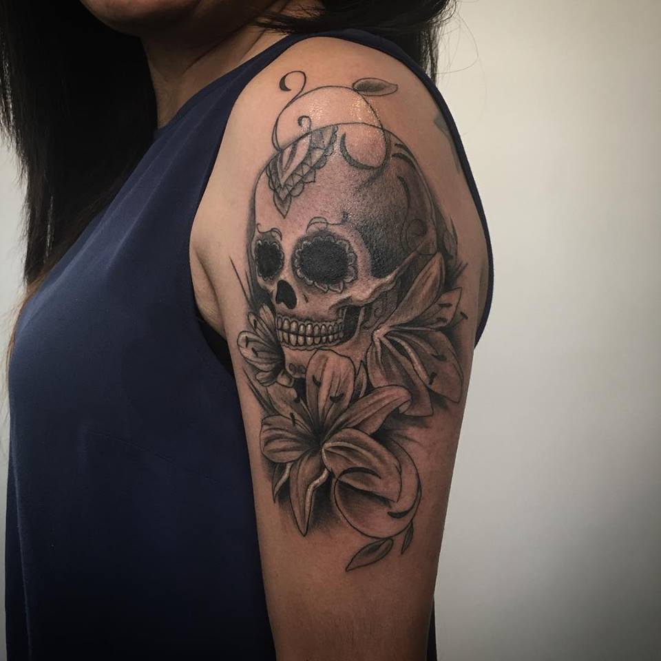 Grey Flowers And Skull Tattoo On Left Shoulder