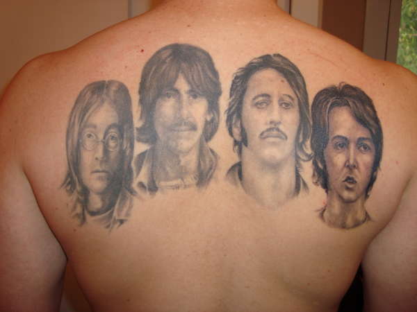 Grey Ink Beatles Faces Tattoo On Upper Back