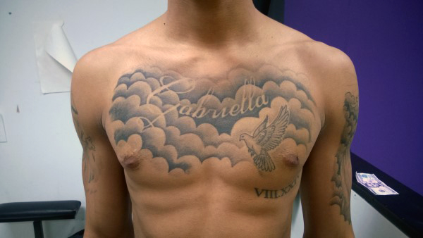 Grey Ink Clouds And Flying Dove Tattoo On Man Chest