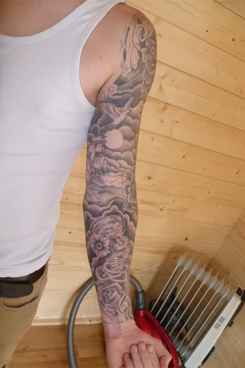 Grey Ink Clouds With Flowers Tattoo On Left Full Sleeve