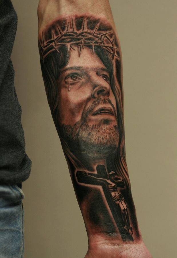 Grey Ink Crucified Jesus Tattoo On Left Forearm by Anders Grucz