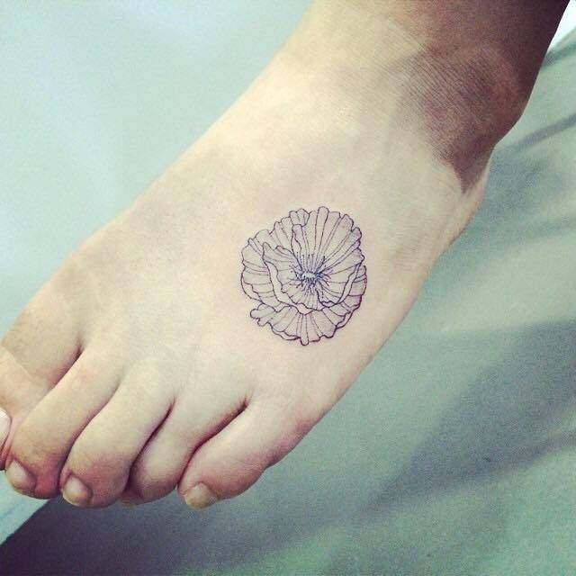 Grey Ink Poppy Flower Tattoo On Left Foot