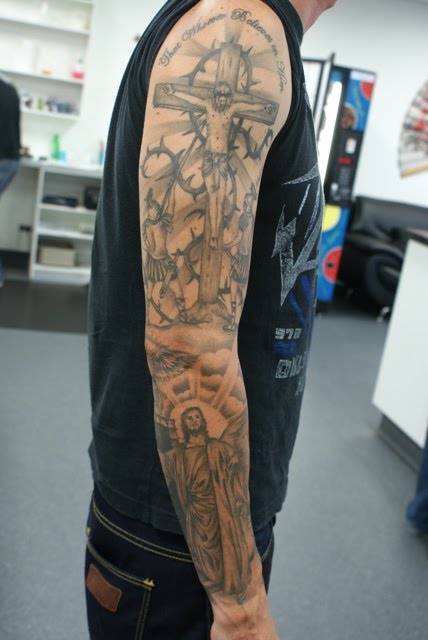 Grey Ink Religious Jesus On Cross With Angel Tattoo On Right Full Sleeve