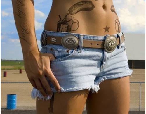Grey Ink Revolver Tattoo On Hip For Girls