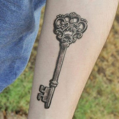 Grey Ink Skeleton Key Tattoo On Left Forearm