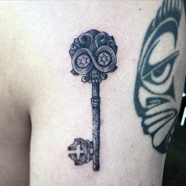 Grey Ink Skeleton Key Tattoo On Left Shoulder