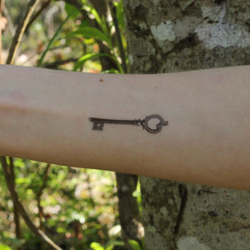 Grey Ink Skeleton Key Tattoo On Right Forearm