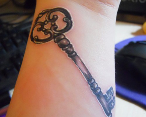 Grey Ink Skeleton Key Tattoo On Wrist