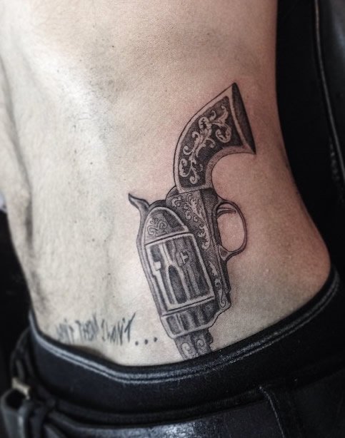 Grey Side Hip Revolver Tattoo