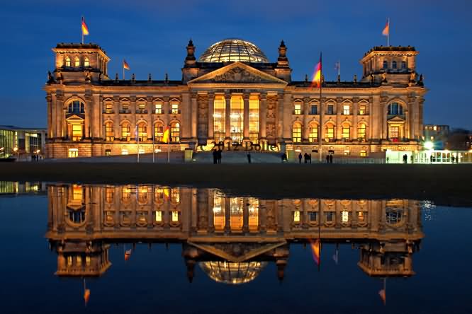 Incredible Water Reflection Of The Reichstag Building In Berlin At Night