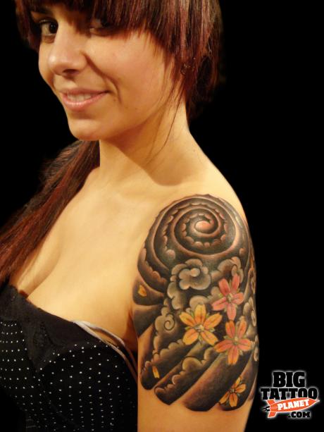 Japanese Cloud With Flowers Tattoo On Girl Left Shoulder