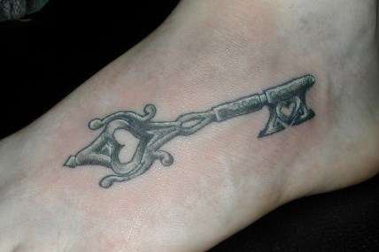 Left Foot Grey Ink Skeleton Key Tattoo