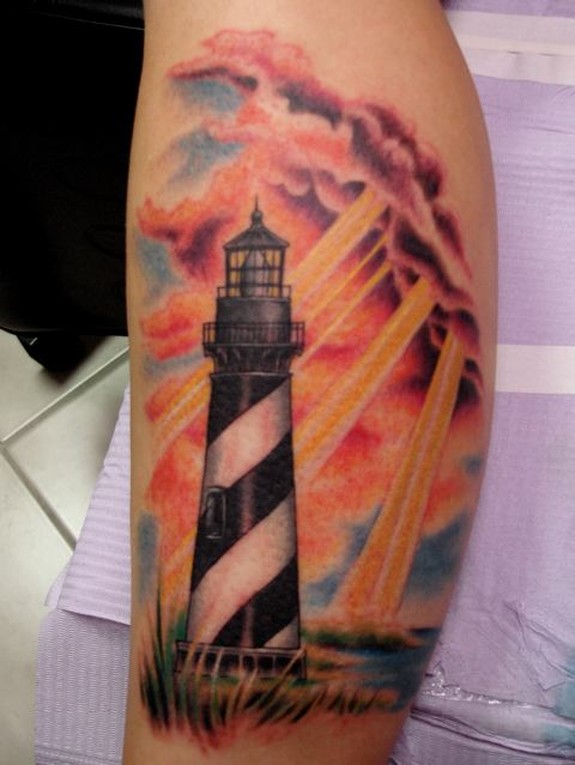 Lighthouse With Clouds Tattoo Design For Leg