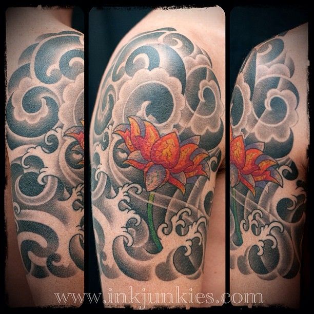 Lotus Flower With Japanese Clouds Tattoo On Right Shoulder