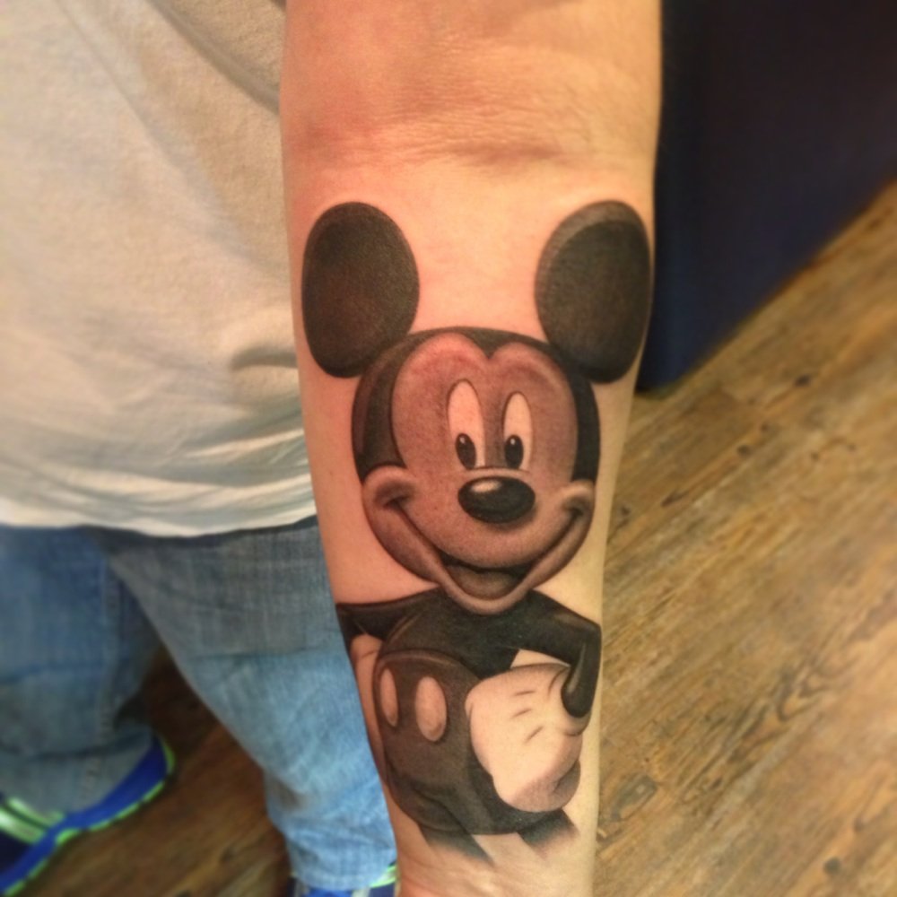 Nice Mickey Mouse Tattoo On Left Forearm