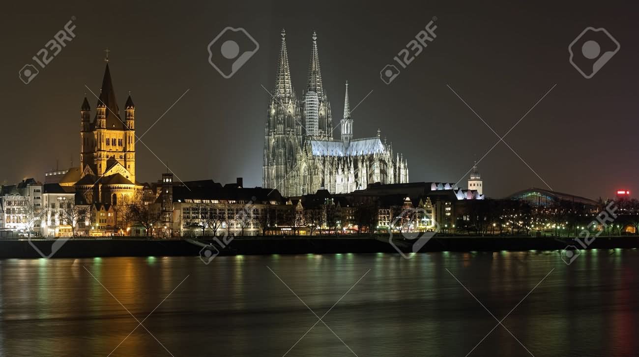 Night View Of Cologne Cathedral And St. Martin Church In Cologne, Germany