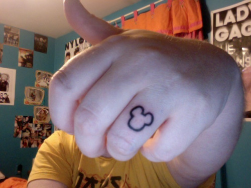Outline Mickey Mouse Tattoo On Finger