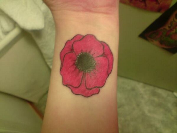 Pink Poopy Flower Tattoo On Wrist