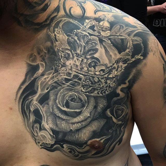 Realistic Black And Grey Rose And Crown Tattoo On Chest by Rember Orellana