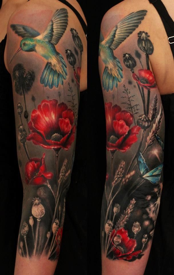 Realistic Poppy Flowers With Flying Bird Tattoo On Left Half Sleeve