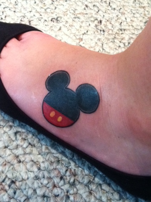 Red And Black Mickey Mouse Tattoo On Left Foot