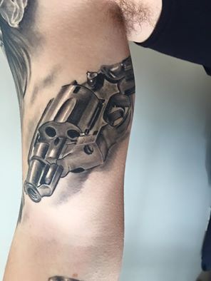 Revolver Tattoo On Right Bicep by Tattoo Mini