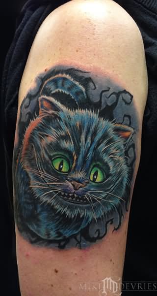 Right Bicep Cheshire Cat Tattoo