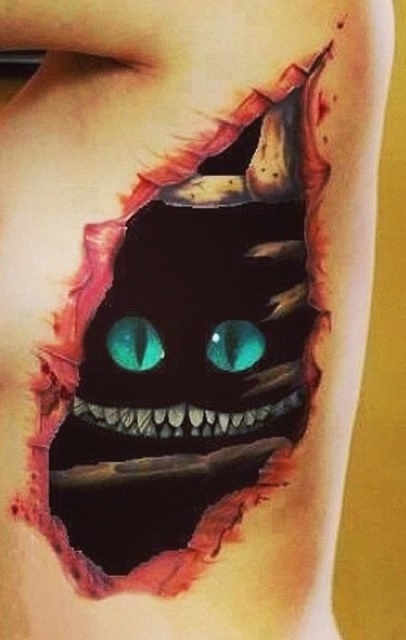 Ripped Skin Cheshire Cat Tattoo On Rib Side